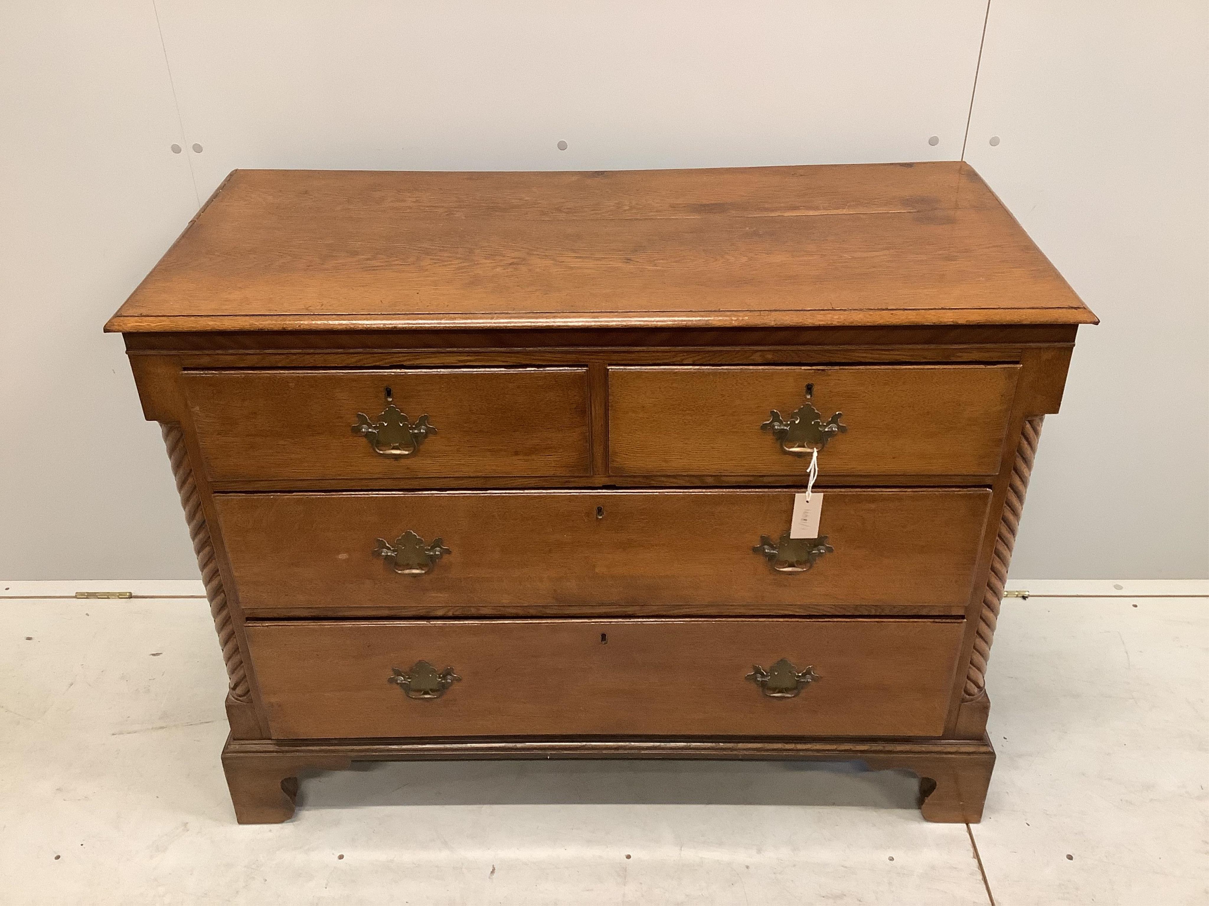 A George III oak four drawer chest, width 114cm, depth 51cm, height 88cm. Condition - fair